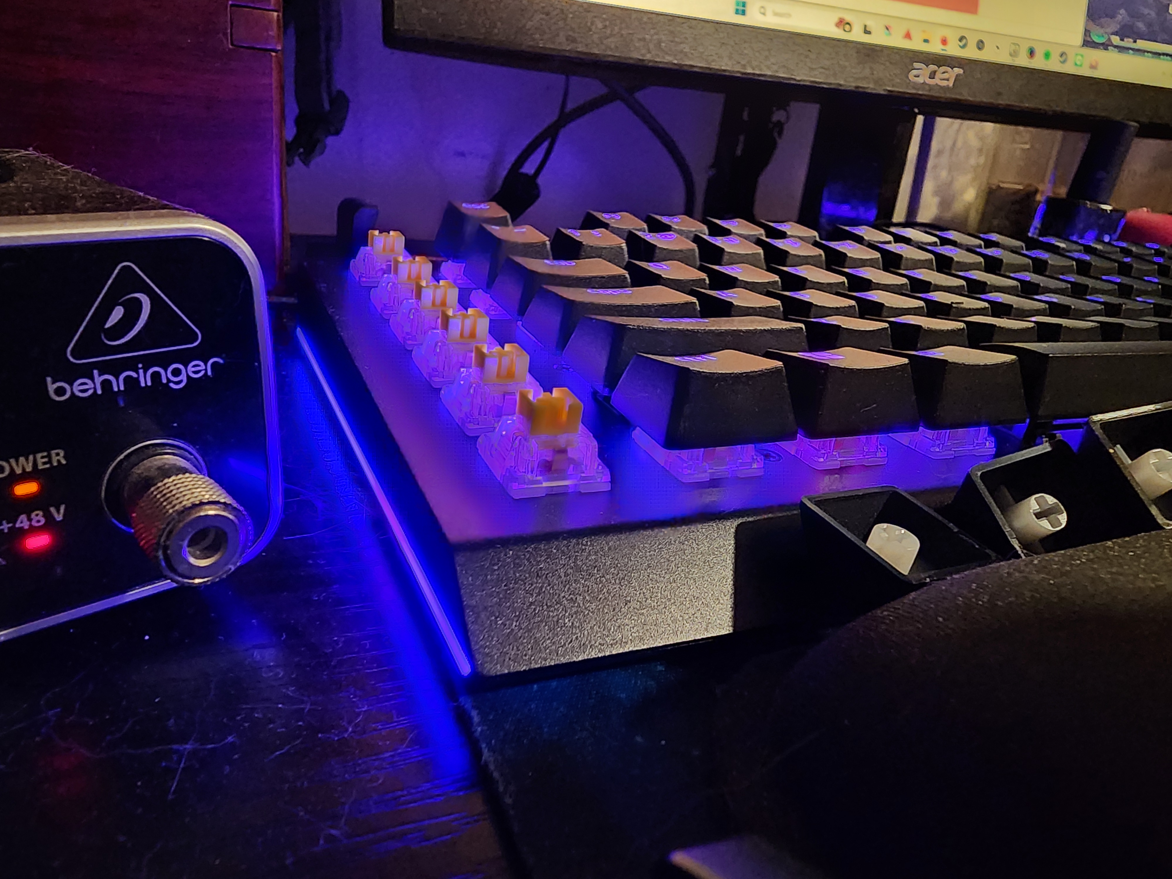 A picture of the east side of a Razer BlackWidow V4 with the keycaps off the Macro line to show the Yellow Switches underneath.